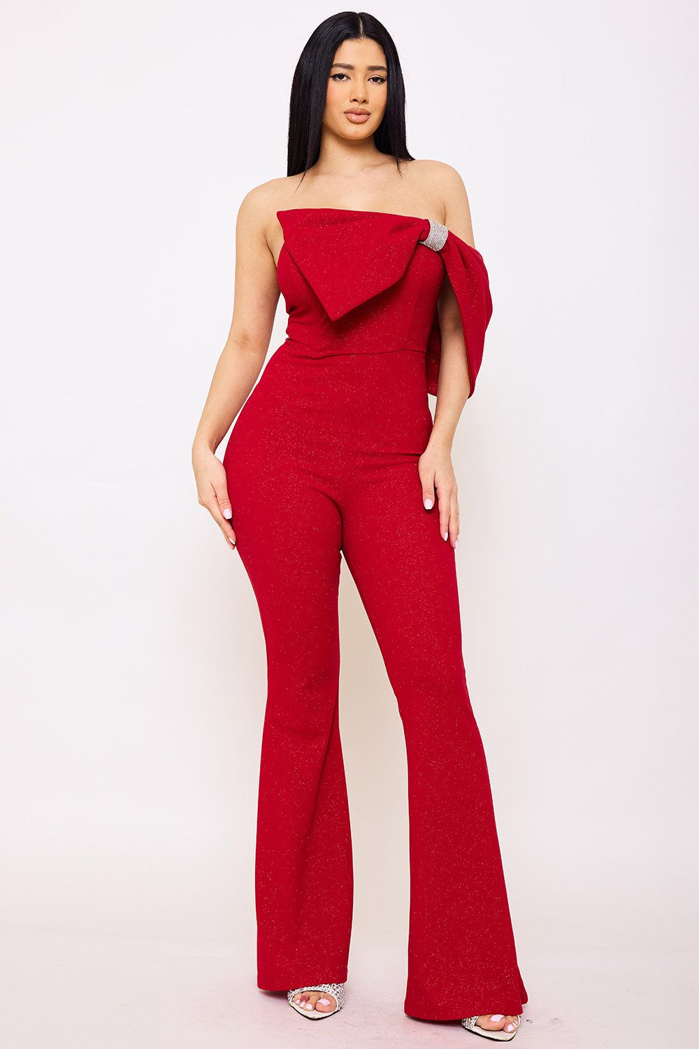 Red strapless shimmer jumpsuit with side bow detail and flared legs for a formal party look by Boutinie.
