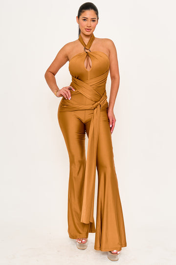 Bronze halter-neck jumpsuit with a keyhole cutout, waist tie, and flared legs, perfect for a chic evening outfit.