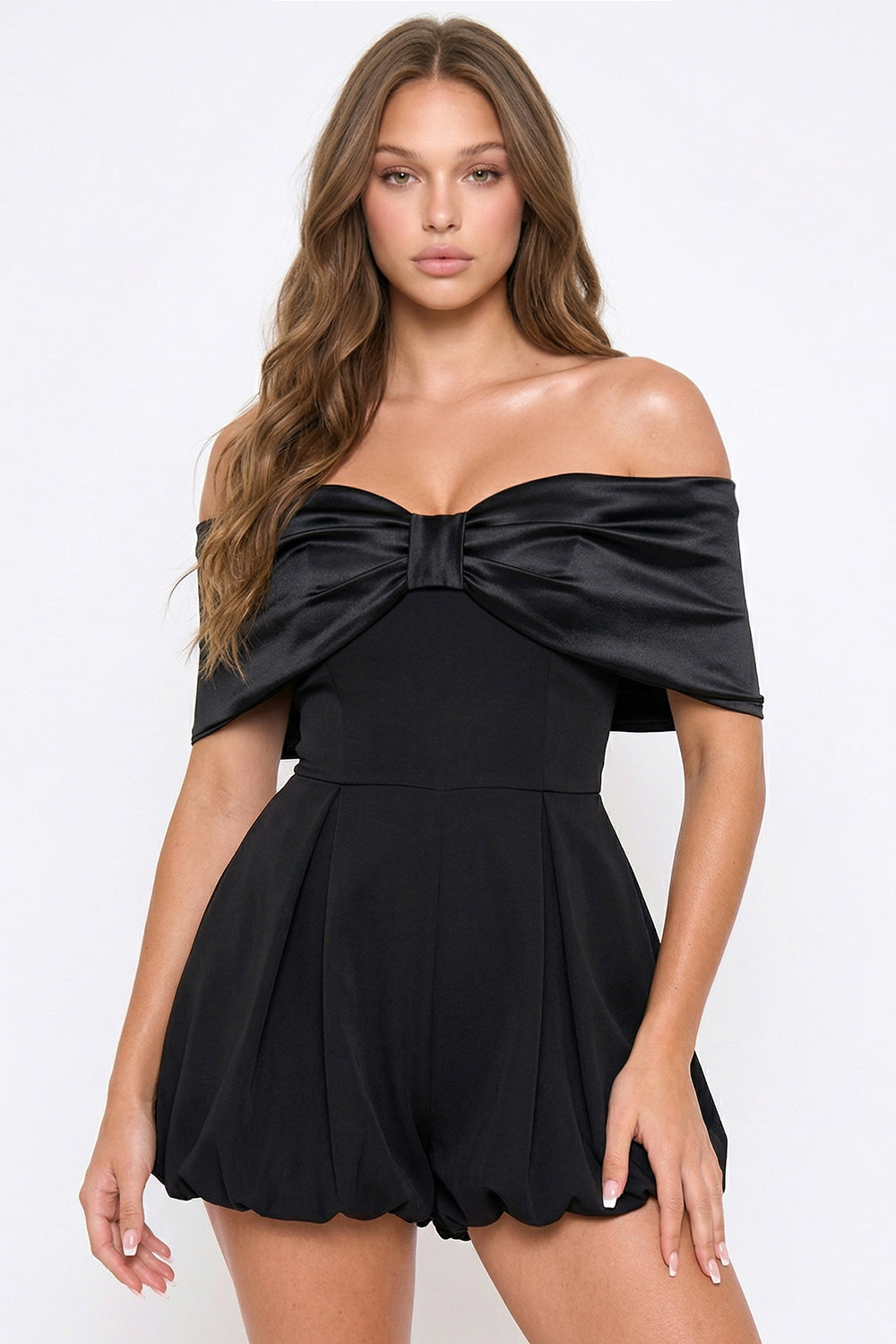Black off-the-shoulder formal romper featuring a satin bow detail and bubble hem, perfect for evening wear.