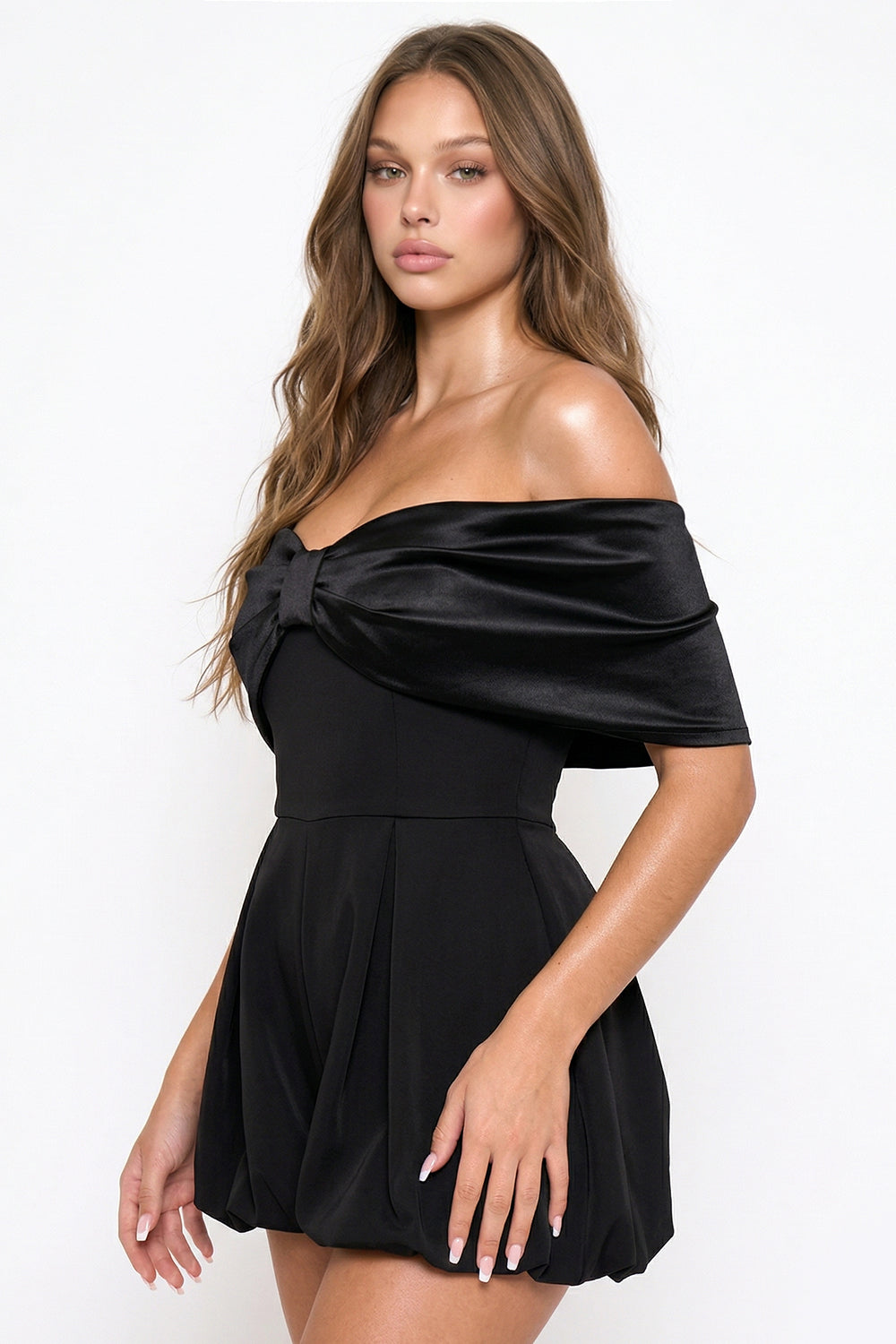Black off-the-shoulder party romper with a draped satin neckline and chic bubble hem from Boutinie.