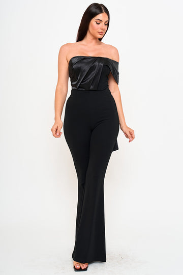 Black strapless jumpsuit with pleated satin bodice and flared trousers for an elegant evening look from Boutinie.