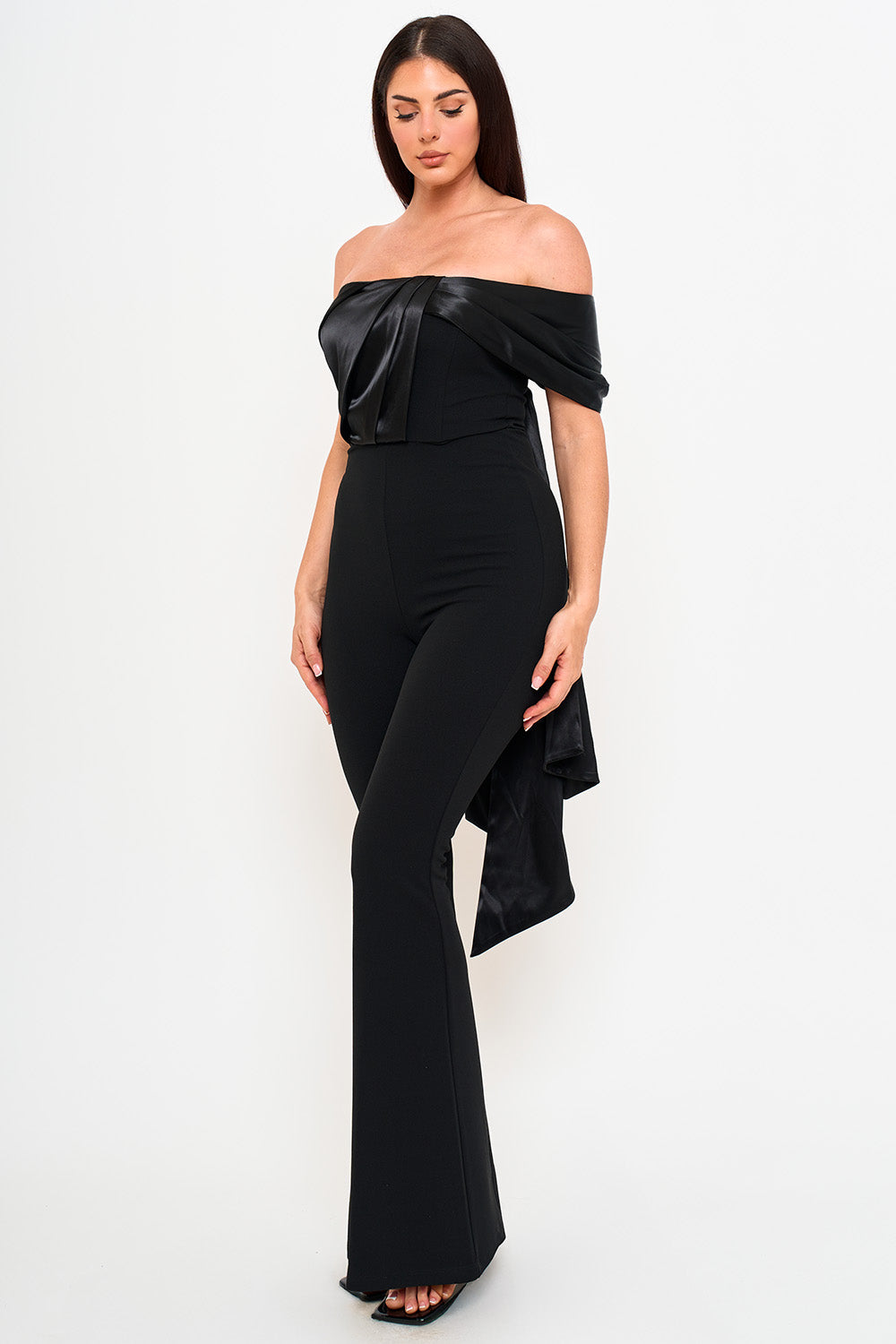 Black off-shoulder formal jumpsuit with satin bodice detail and flared legs for a chic evening look from Boutinie.