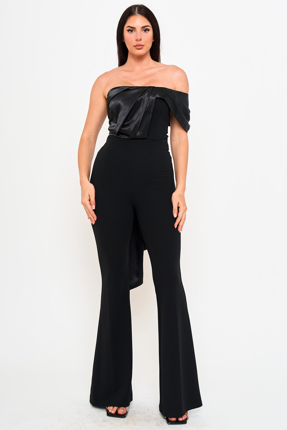 Boutinie black strapless jumpsuit featuring a draped satin bodice and flared pants for an elegant evening look.