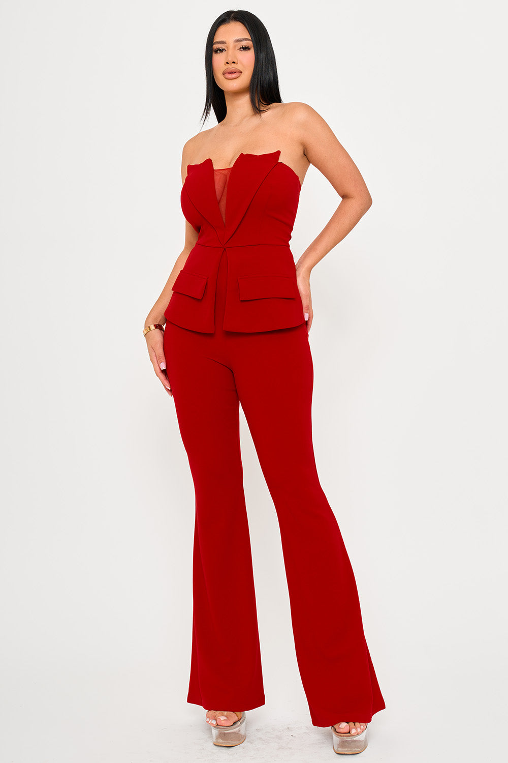 Red strapless jumpsuit with blazer-style peplum bodice and flared legs for a chic evening look from Boutinie.
