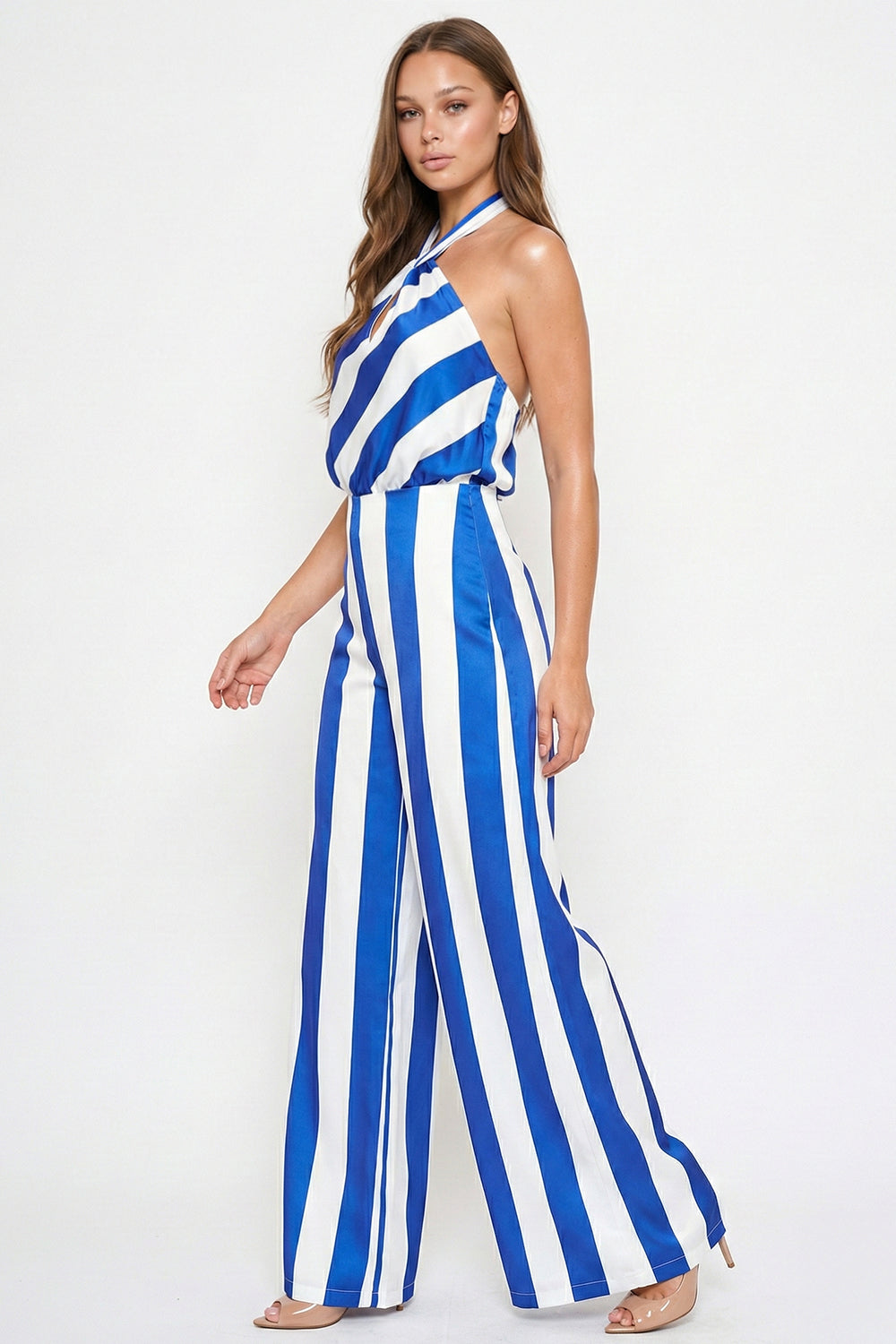 Blue and white striped halter-neck wide-leg jumpsuit with a satin finish, perfect for a summer occasion by Boutinie.