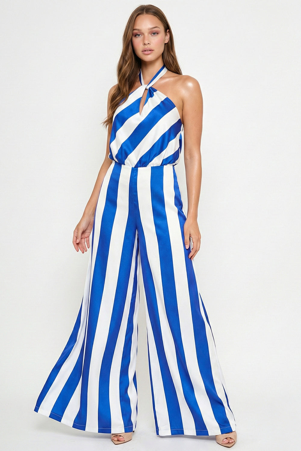 Blue and white striped halter-neck jumpsuit with wide-leg trousers from Boutinie, perfect for a chic summer event.