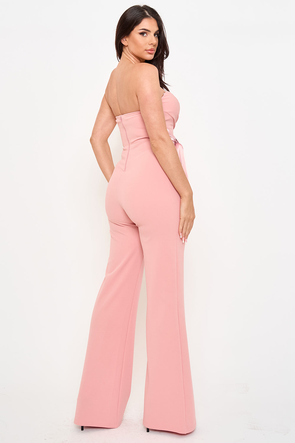 Boutinie dusty pink strapless wide-leg jumpsuit with a belted waist for a chic evening look.