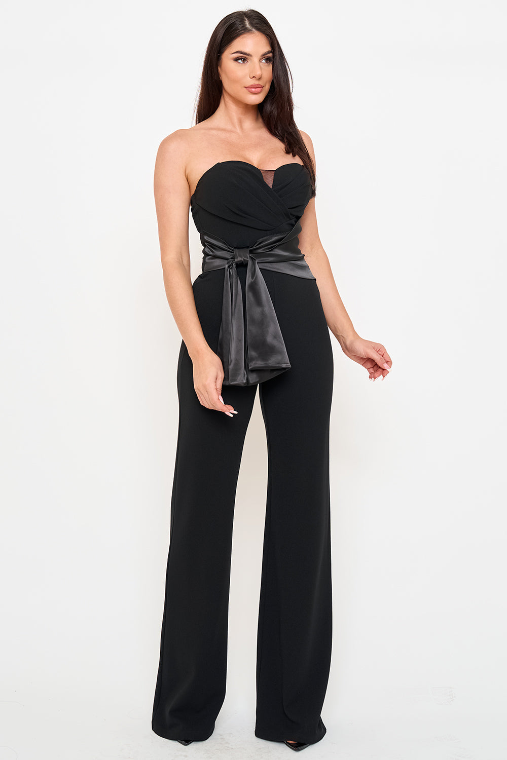 Black strapless jumpsuit with satin tie-waist and wide-leg silhouette, perfect for elegant formal evening wear.