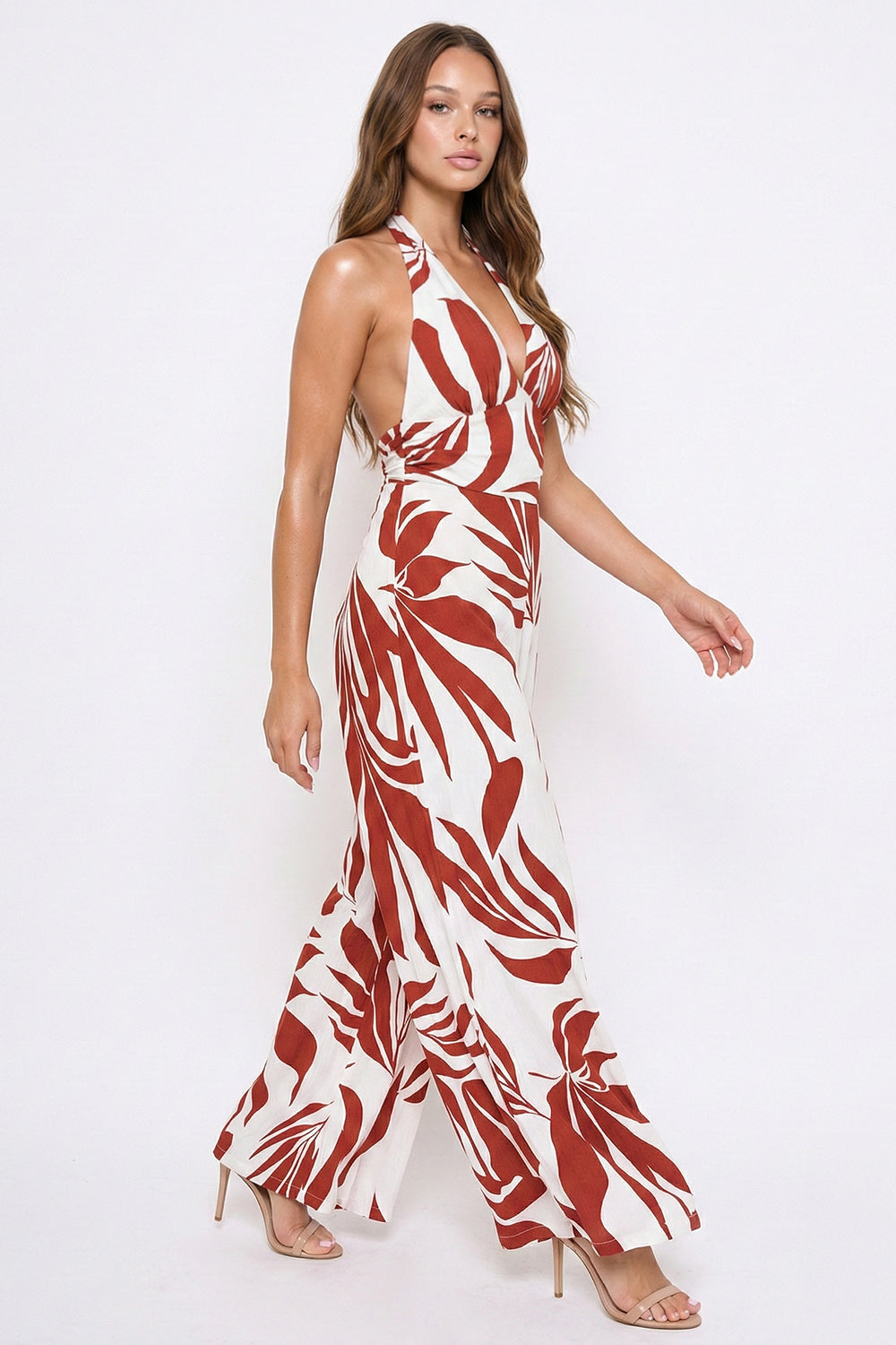 Boutinie rust and cream leaf-print halter jumpsuit with a plunging neckline and wide-leg fit for summer occasions.