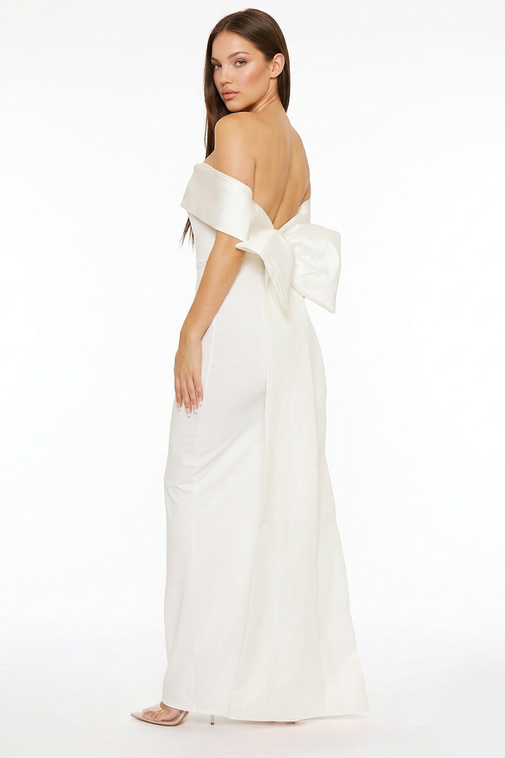 White off-the-shoulder evening gown with a large back bow, slim silhouette, and elegant satin finish.