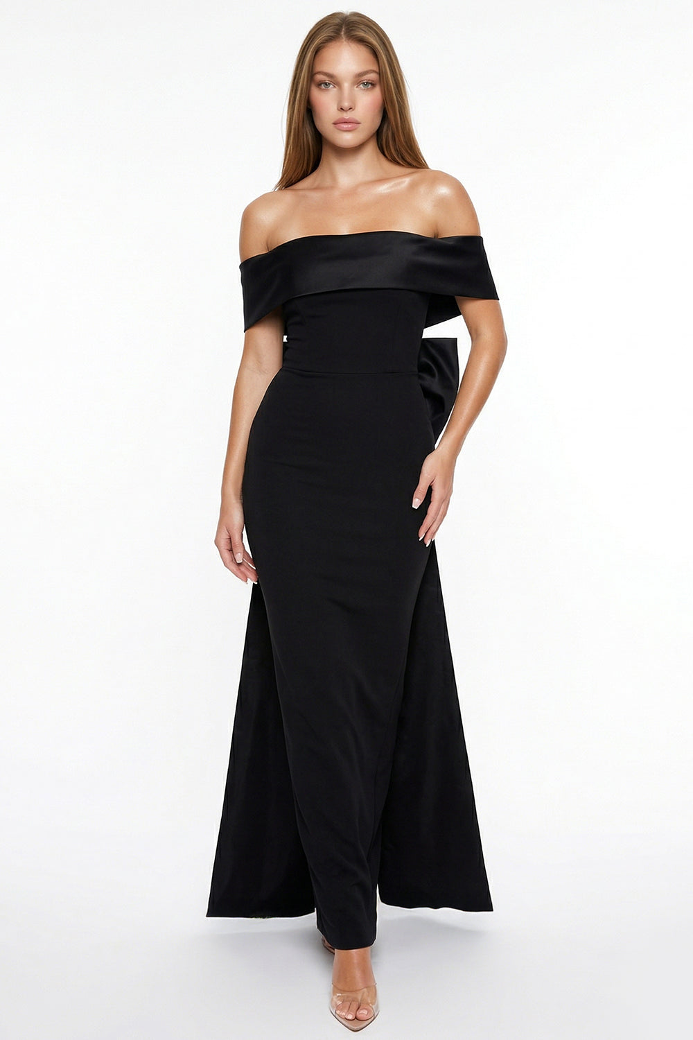Black off-the-shoulder evening gown with a fitted silhouette, satin fold-over neckline, and back bow detail.