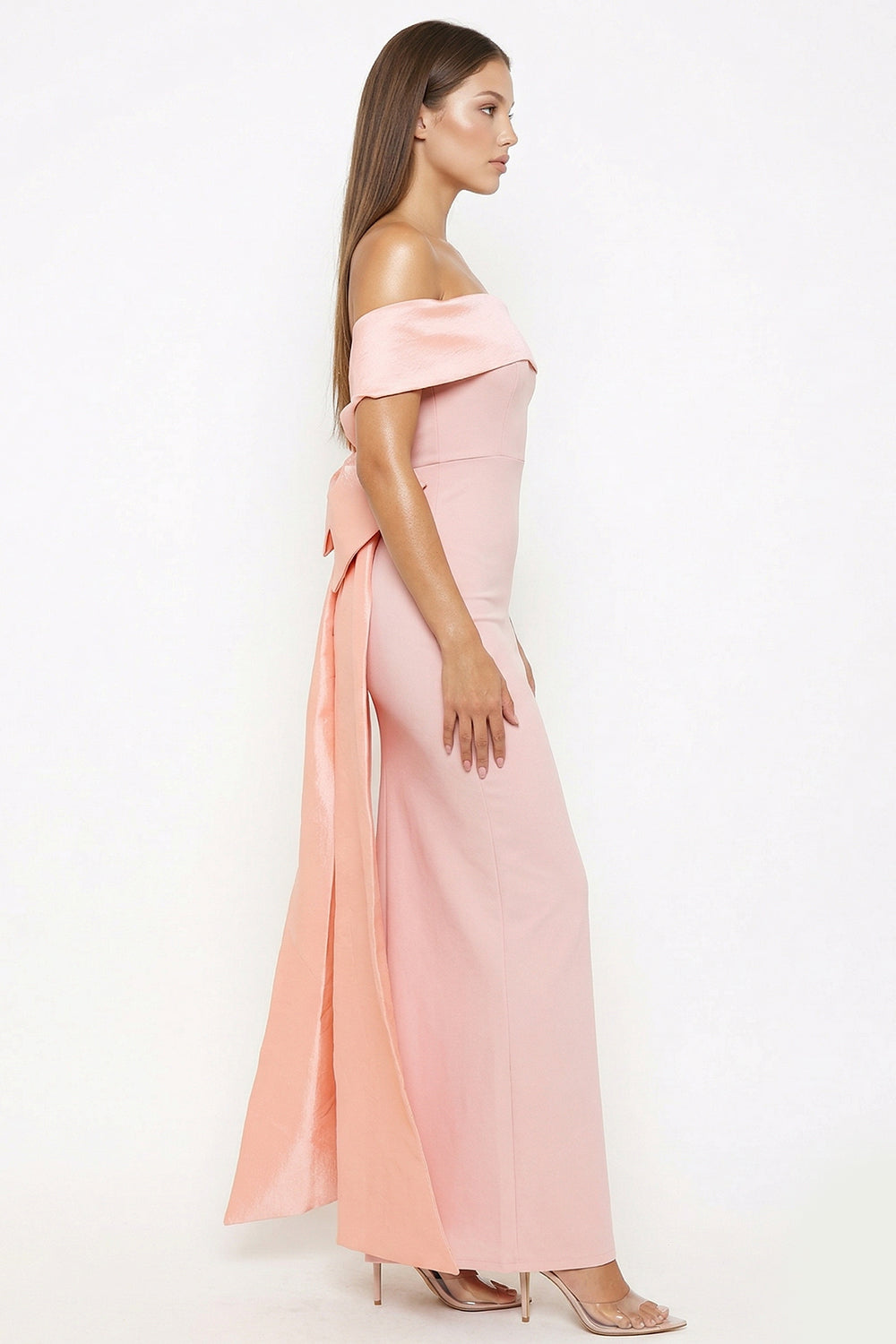 Blush pink off-the-shoulder evening gown with draped back bow detail for formal events at Boutinie.