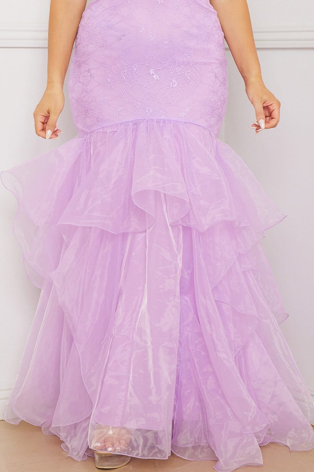 Boutinie lavender lace gown featuring a fitted bodice and a dramatic tiered organza mermaid skirt for formal events.