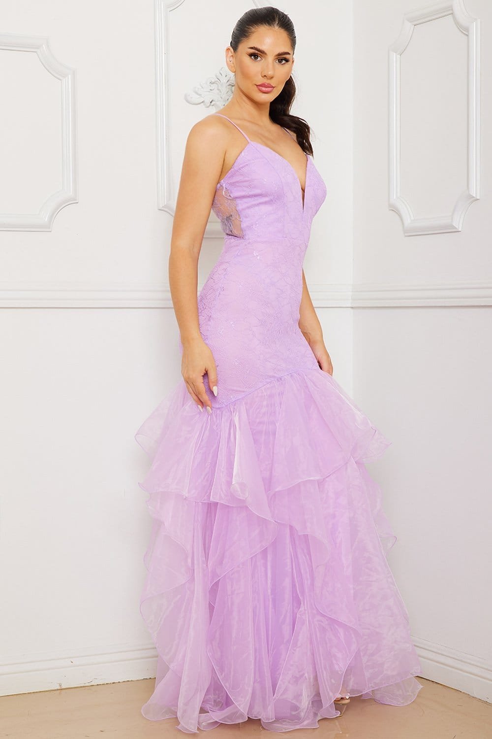 Lavender lace mermaid gown with V-neckline, spaghetti straps, and layered organza skirt for formal events.