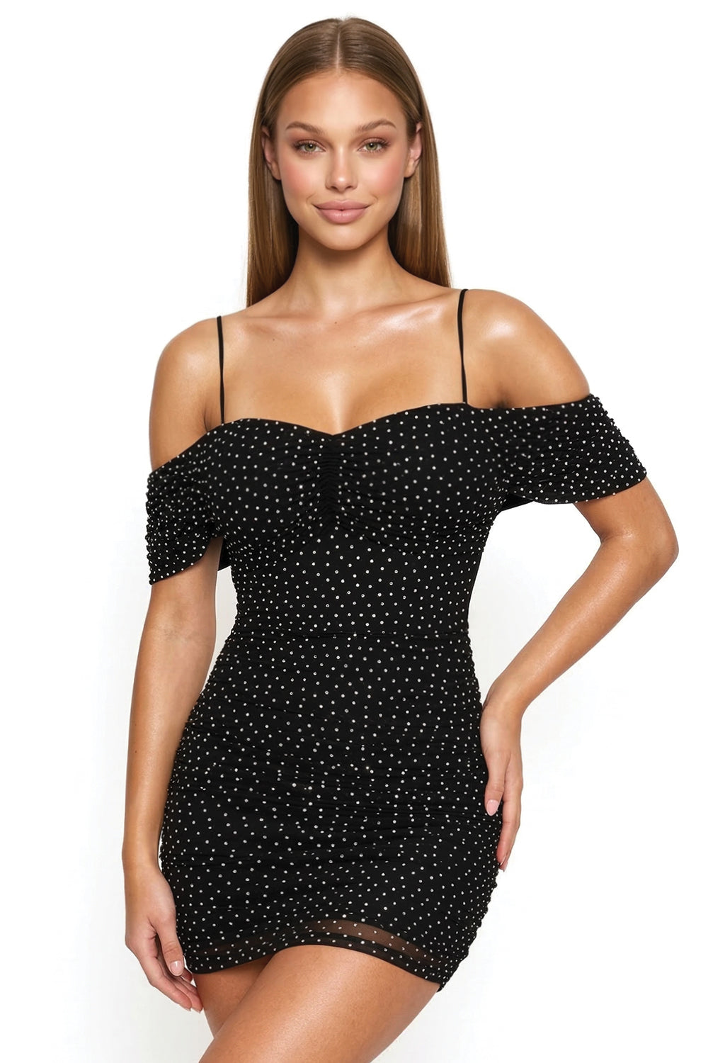 Black polka-dot mini dress with sweetheart neckline, off-shoulder sleeves, and ruched bodycon fit by Boutinie.