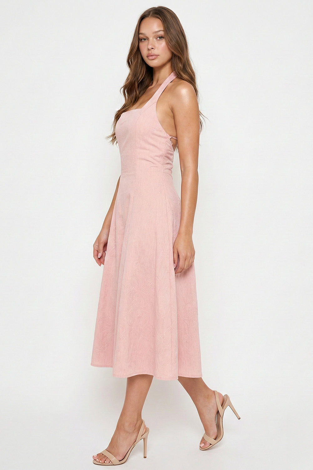 Blush pink midi dress with a square neckline, open back, and fitted bodice from Boutinie, perfect for summer events.