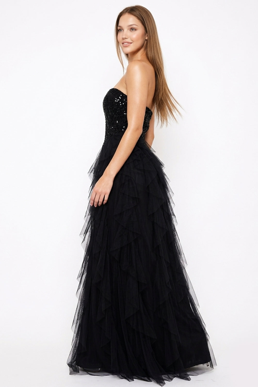 Black strapless sequin bodice gown with a tiered tulle skirt, perfect for formal evening events at Boutinie.