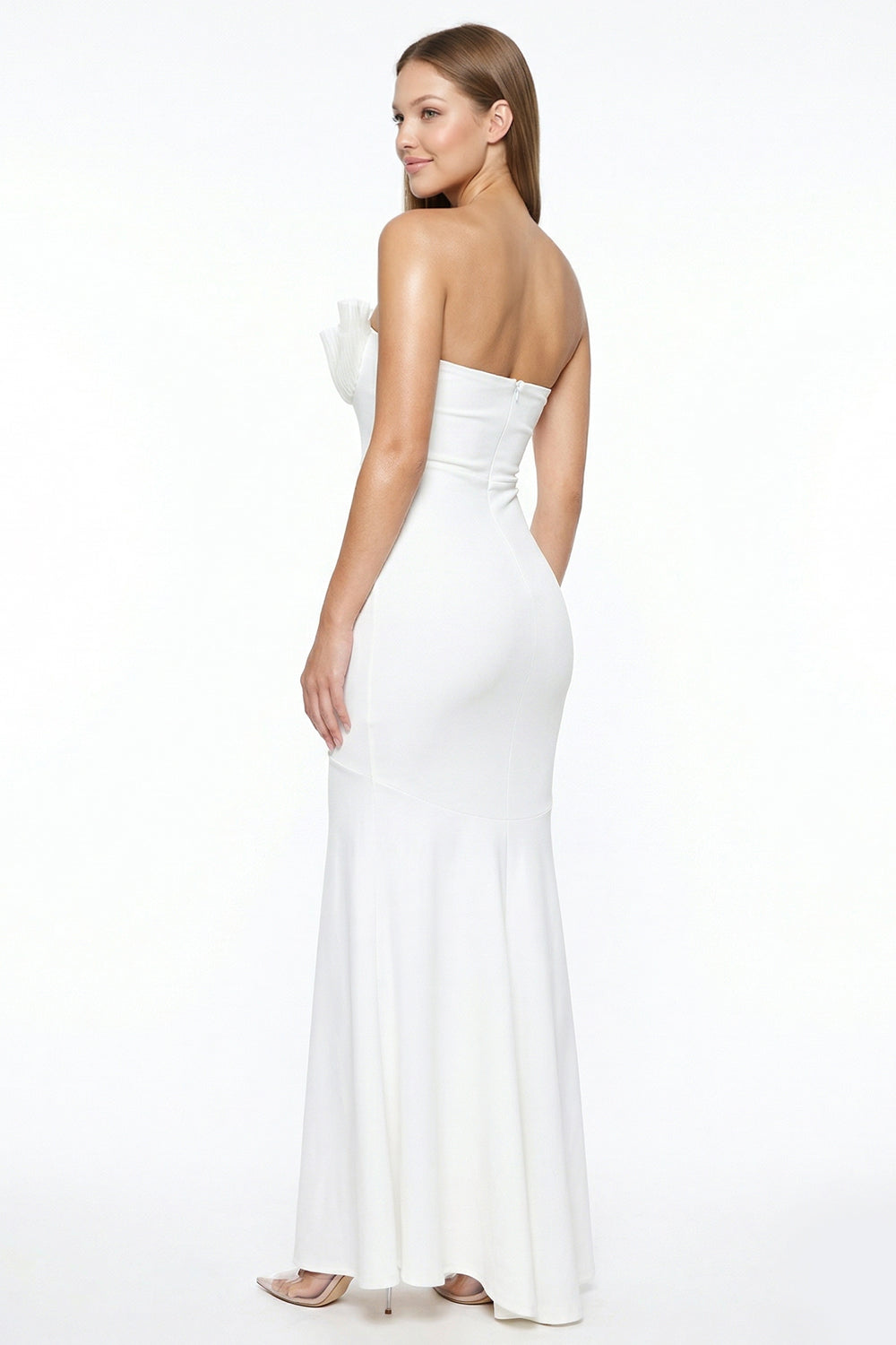 White strapless mermaid evening gown with a ruffled bodice by Boutinie for formal occasions.