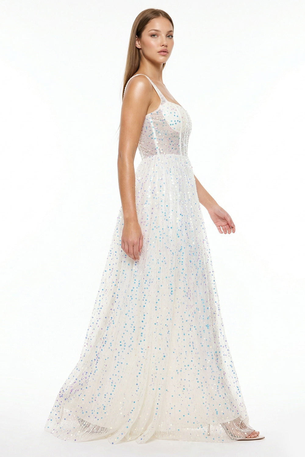 White sequin A-line evening gown by Boutinie with a corset bodice, sweetheart neckline, and sleeveless silhouette.