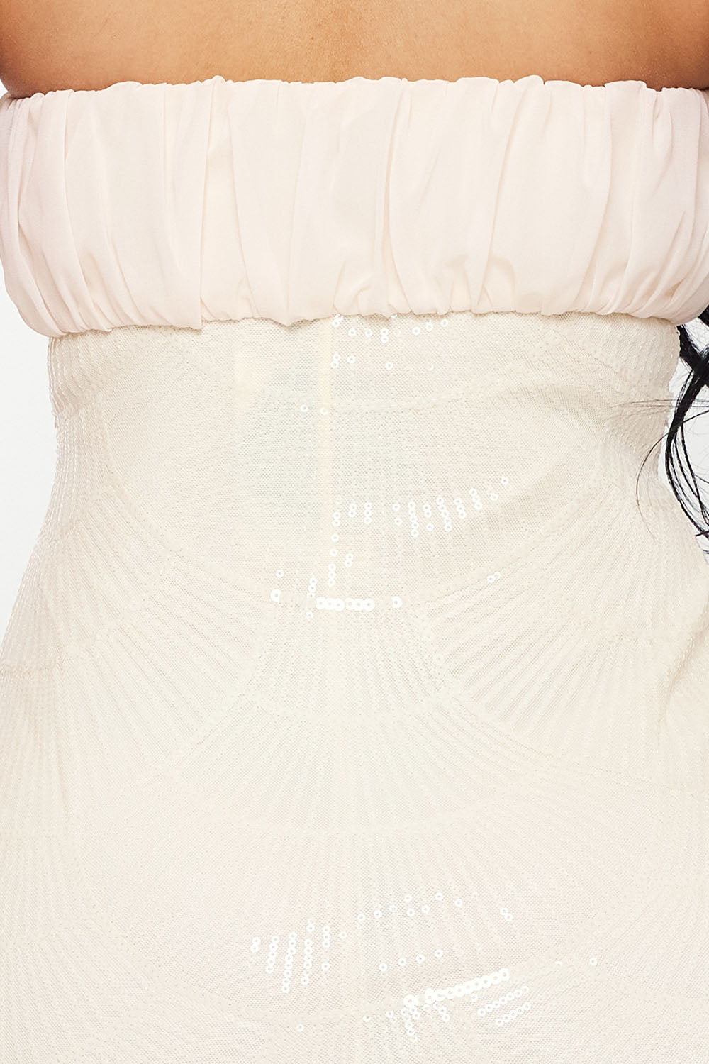 Cream strapless party dress with a ruched chiffon bodice and sequined, Art Deco-inspired scalloped skirt.