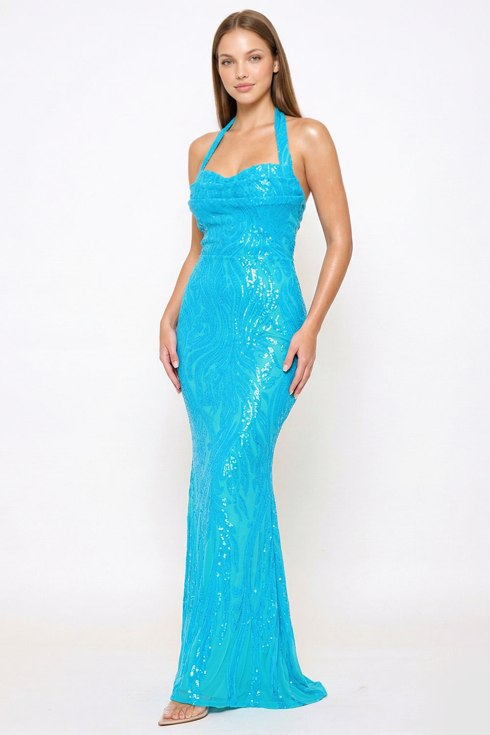 Blue sequin halterneck evening gown with a form-fitting silhouette for a formal event from Boutinie.