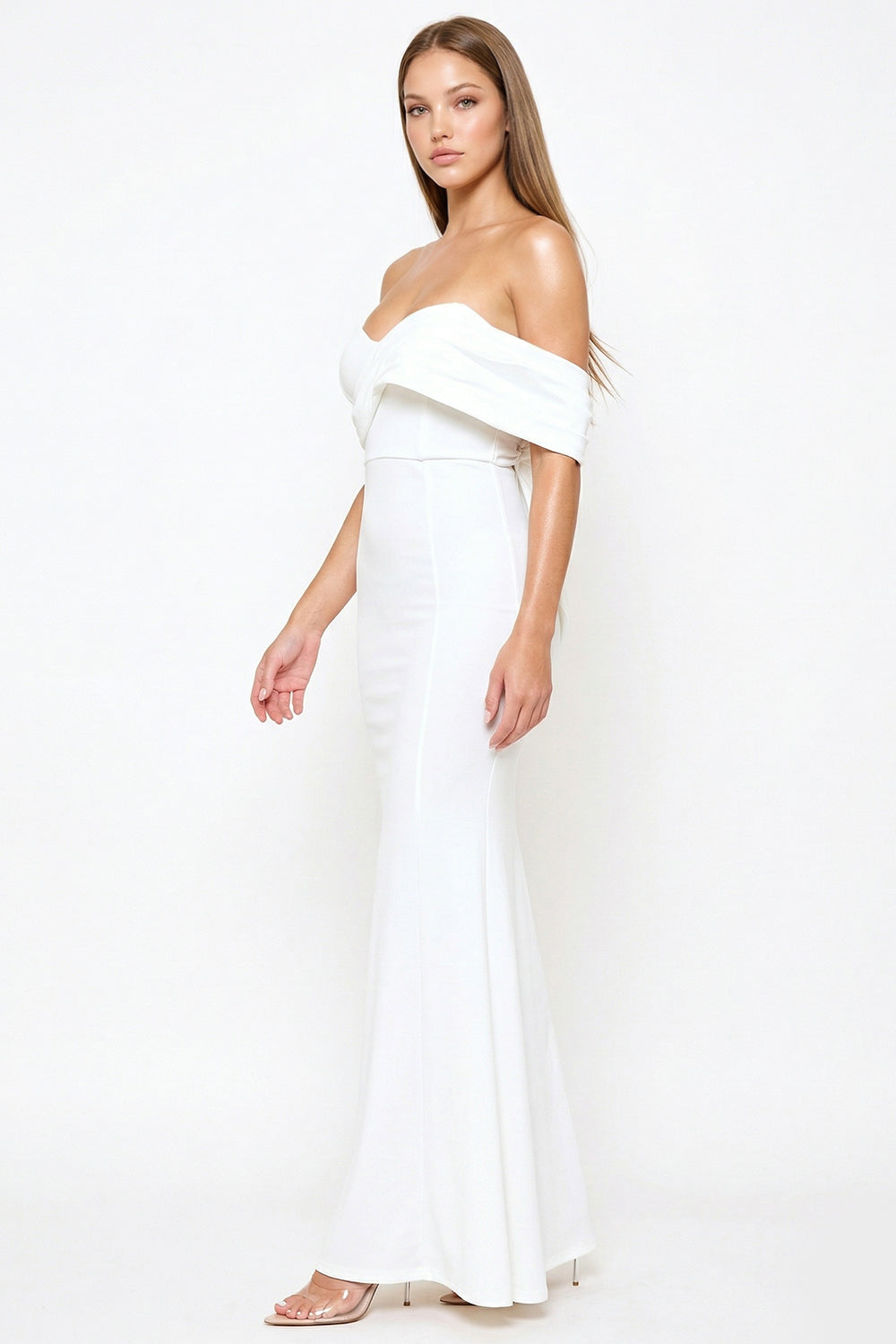 White off-the-shoulder maxi evening dress with a draped bodice and slim-fit silhouette from Boutinie.