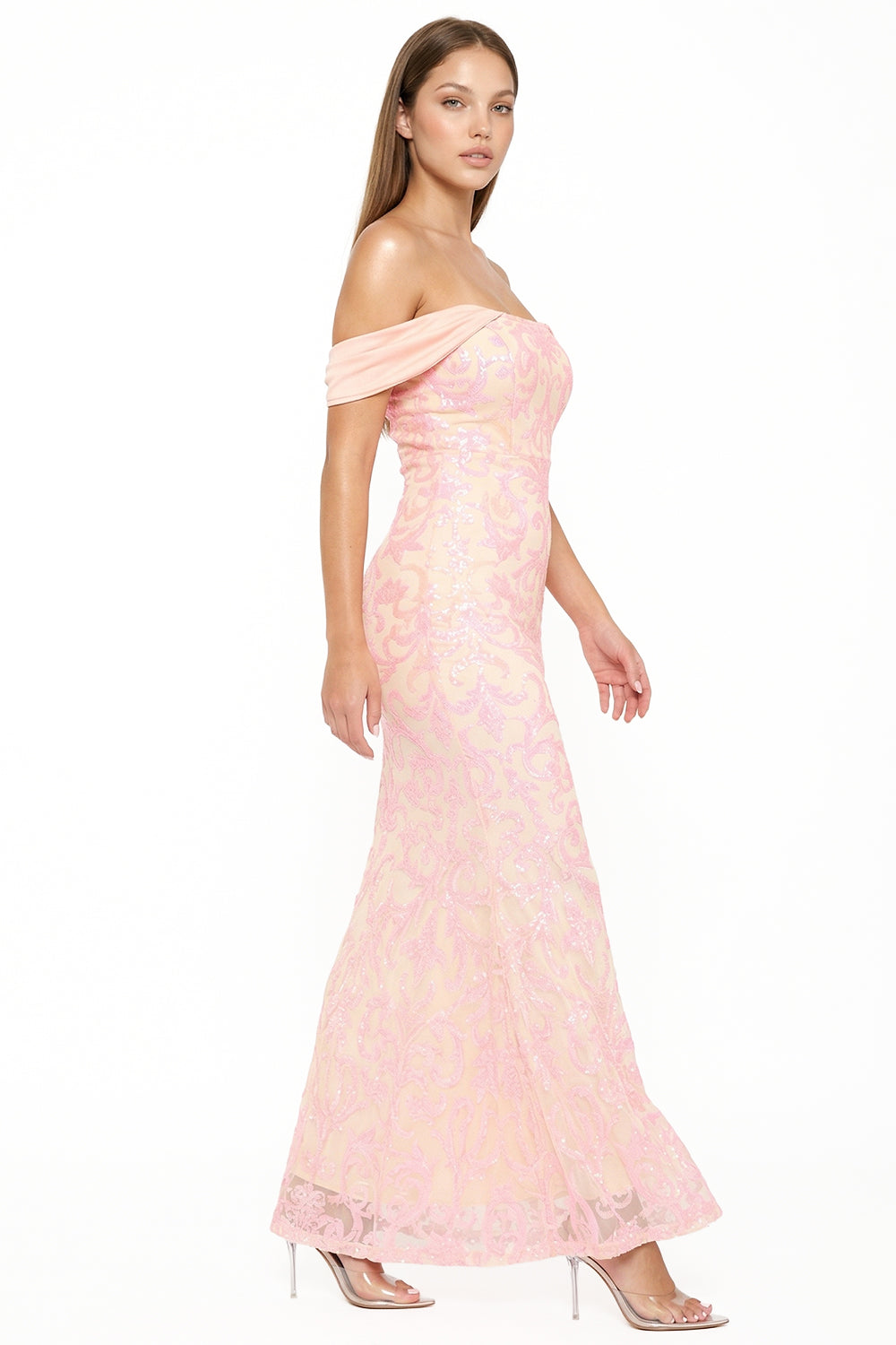 Pale pink off-the-shoulder sequin mermaid evening gown with intricate patterns for a formal event at Boutinie.