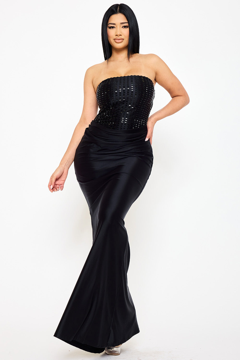 Boutinie black strapless maxi gown featuring a sequin bodice and satin draped skirt, perfect for formal evening wear.