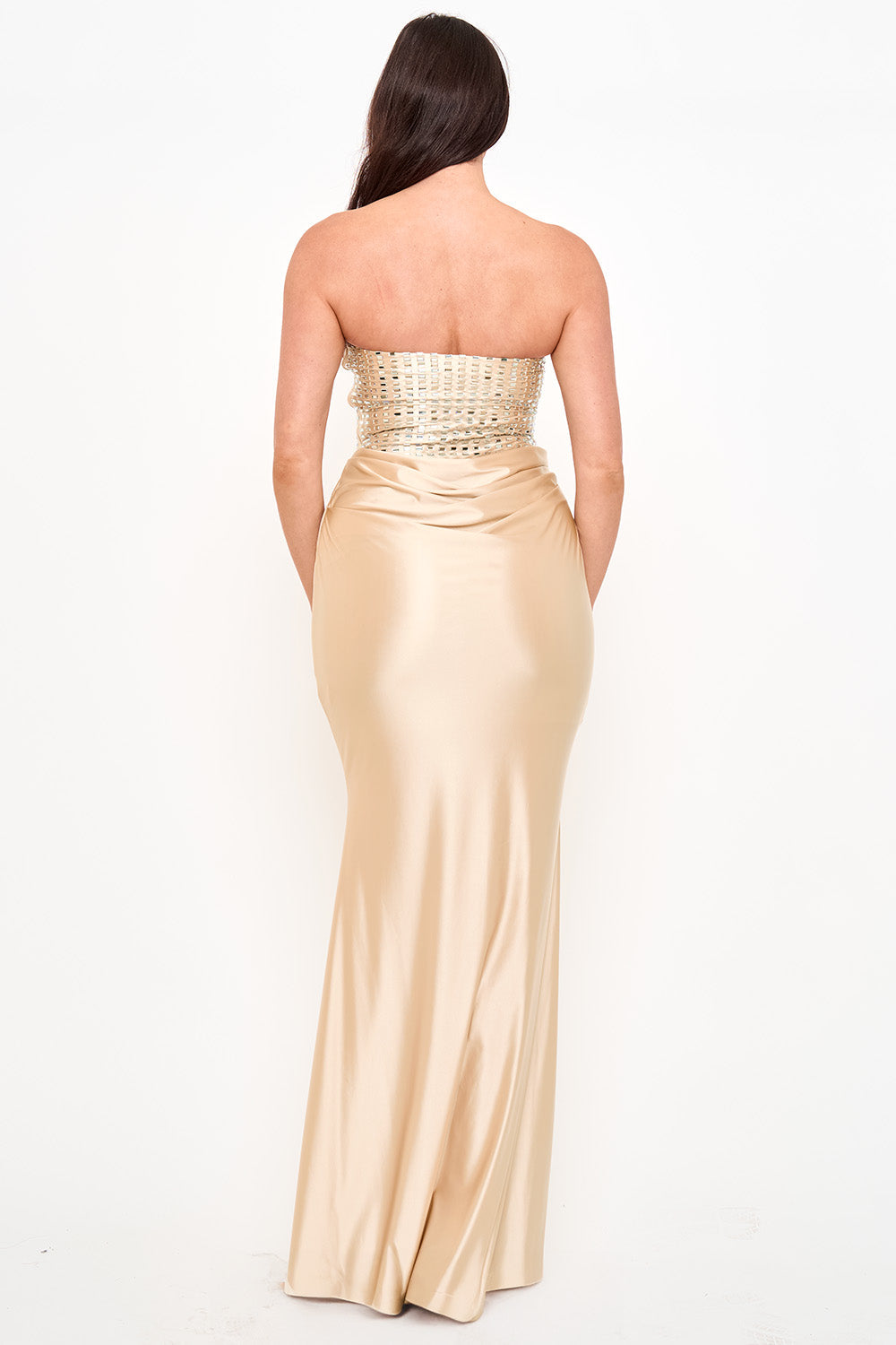 Boutinie strapless gold satin evening gown with a beaded bodice and form-fitting mermaid silhouette.