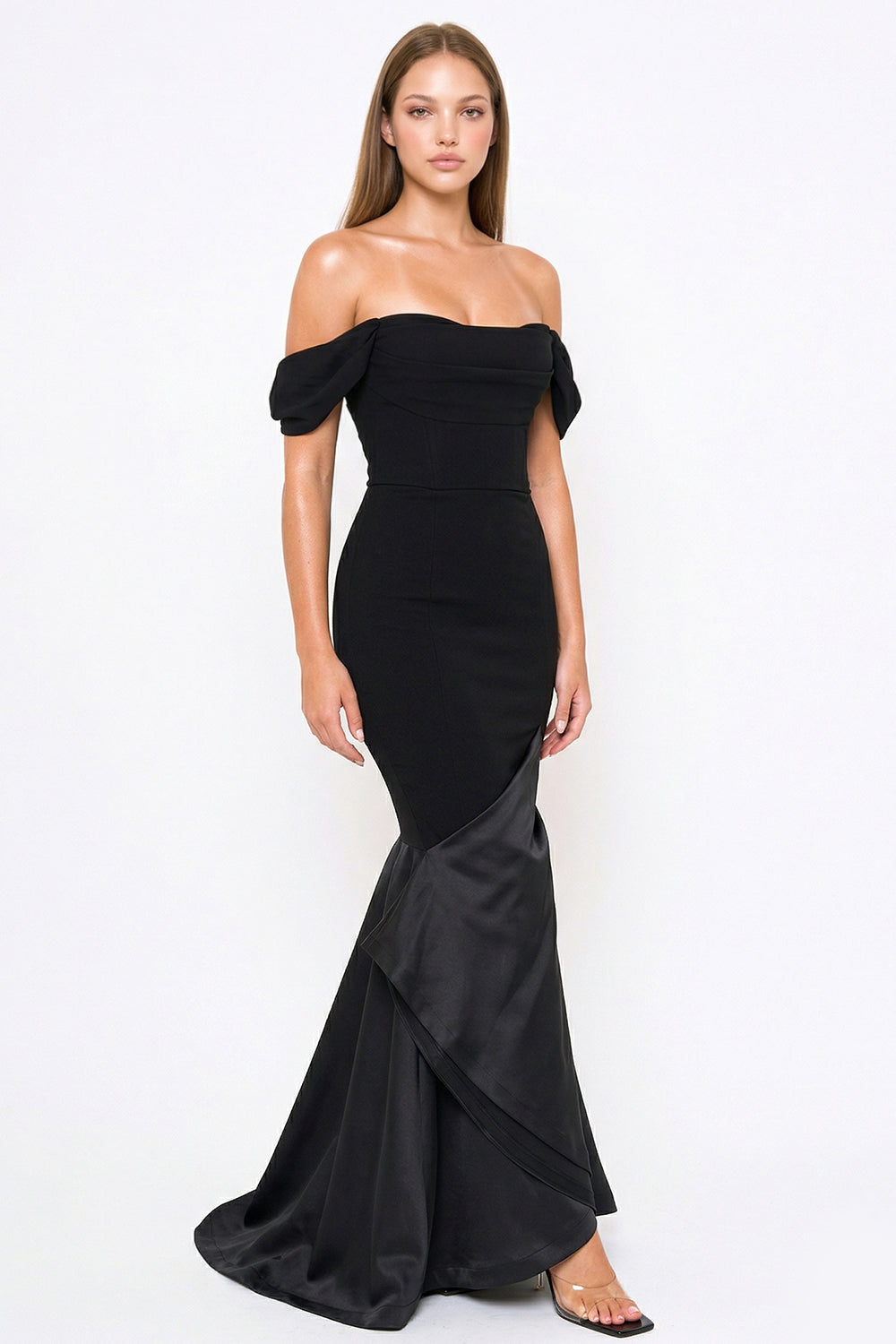 Black off-the-shoulder mermaid gown with a sweetheart neckline and satin drop hem for formal occasions at Boutinie.