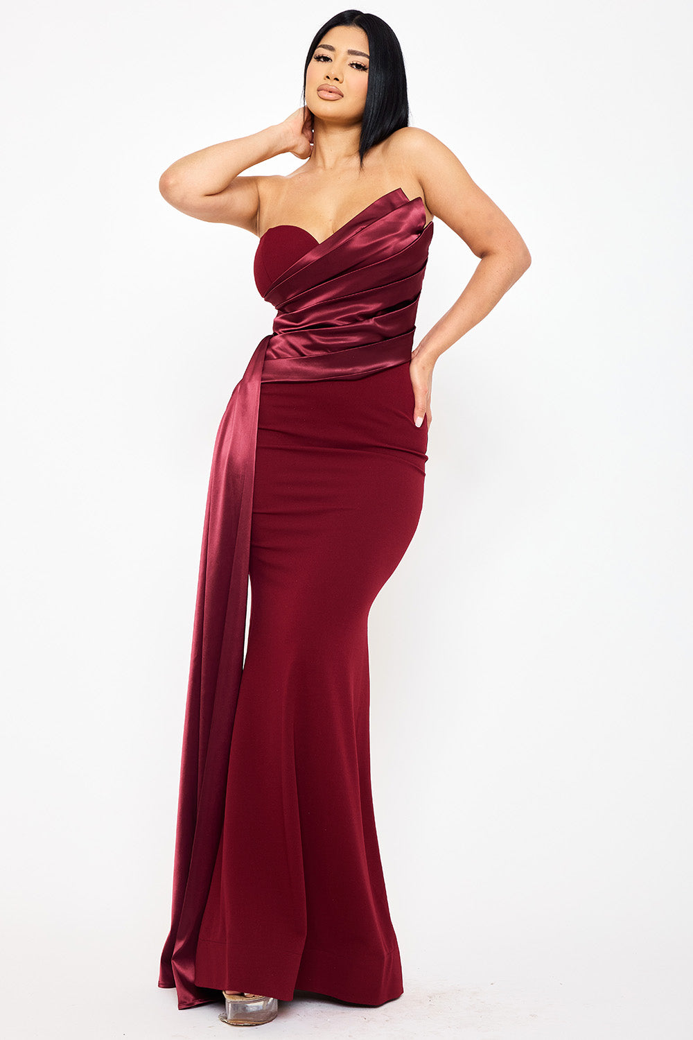 Burgundy strapless mermaid evening gown with satin pleated bodice and side drape for an elegant formal look.