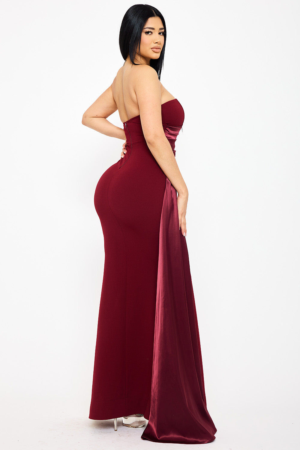 Burgundy strapless mermaid evening gown with satin side train detail from Boutinie, perfect for formal events.