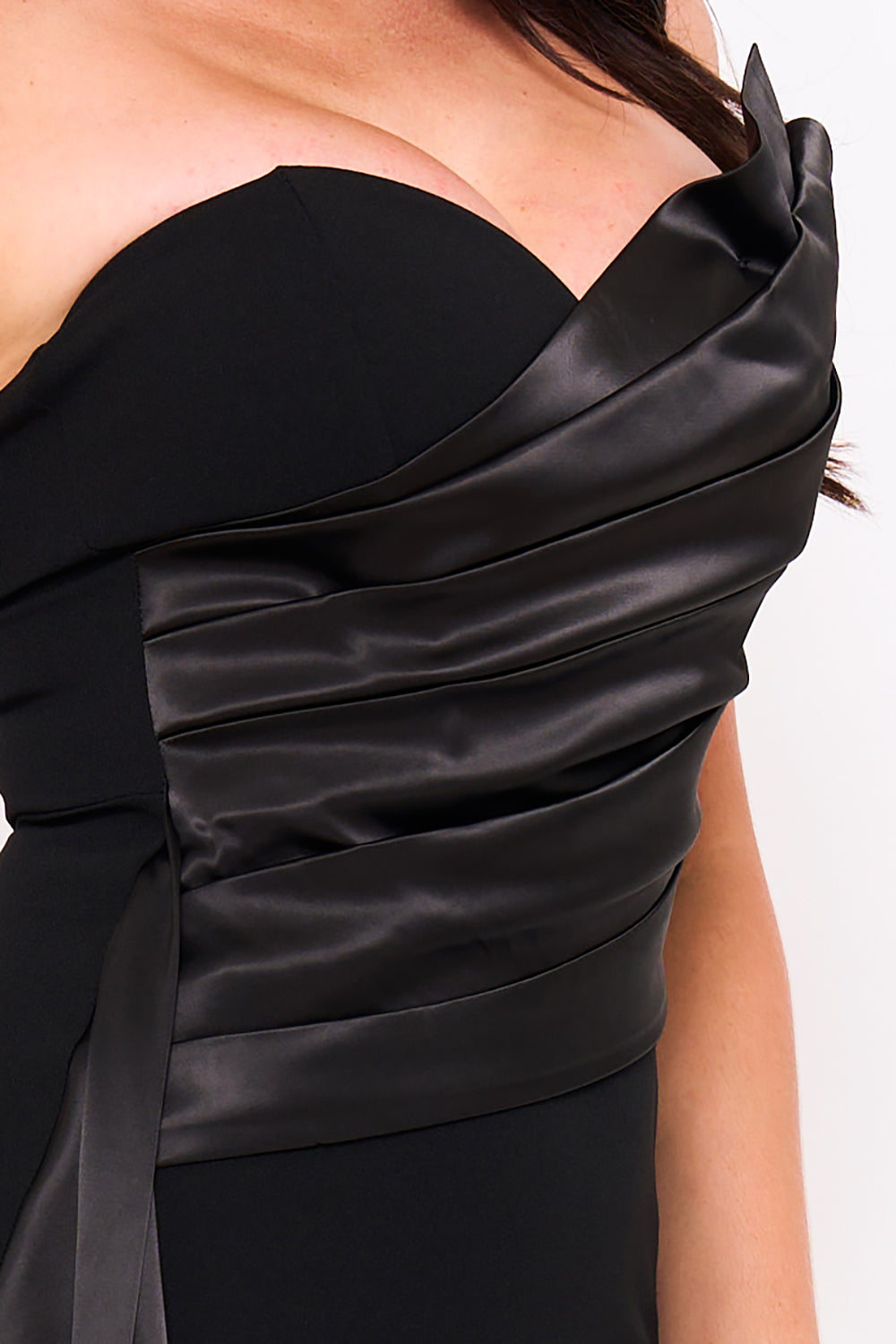 Black strapless evening dress with structured satin pleats and a sweetheart neckline from Boutinie.