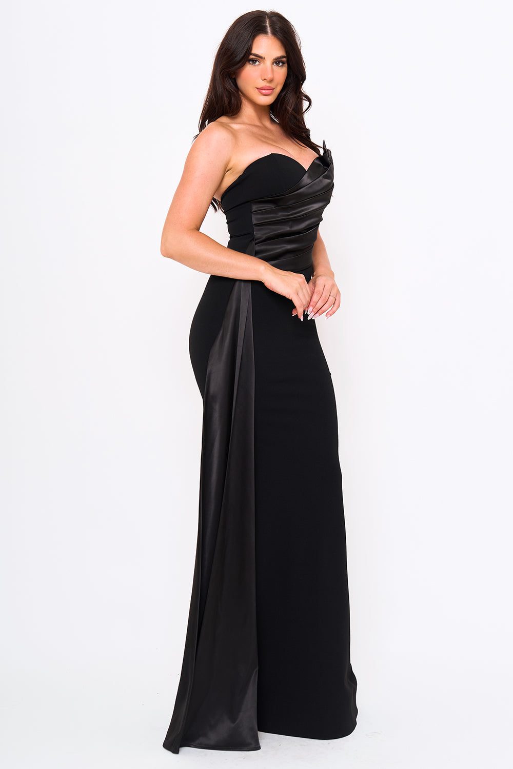 Black strapless evening gown with pleated satin detail and a sleek floor-length silhouette from Boutinie.