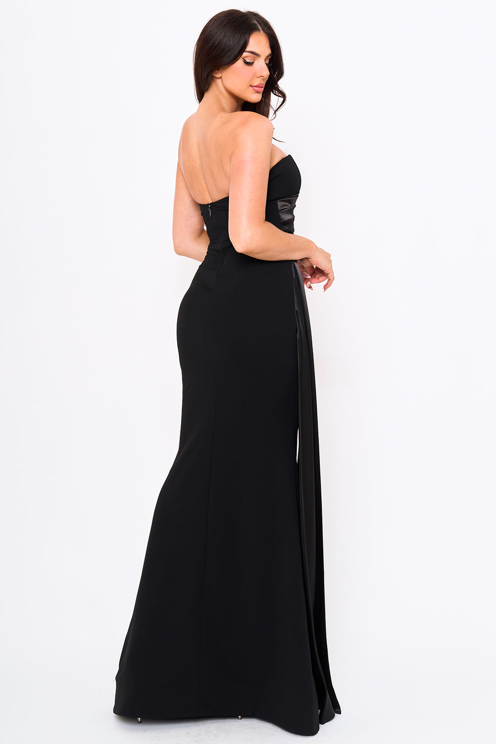 Black strapless maxi evening gown with satin side panels and a fitted silhouette for a formal look by Boutinie.