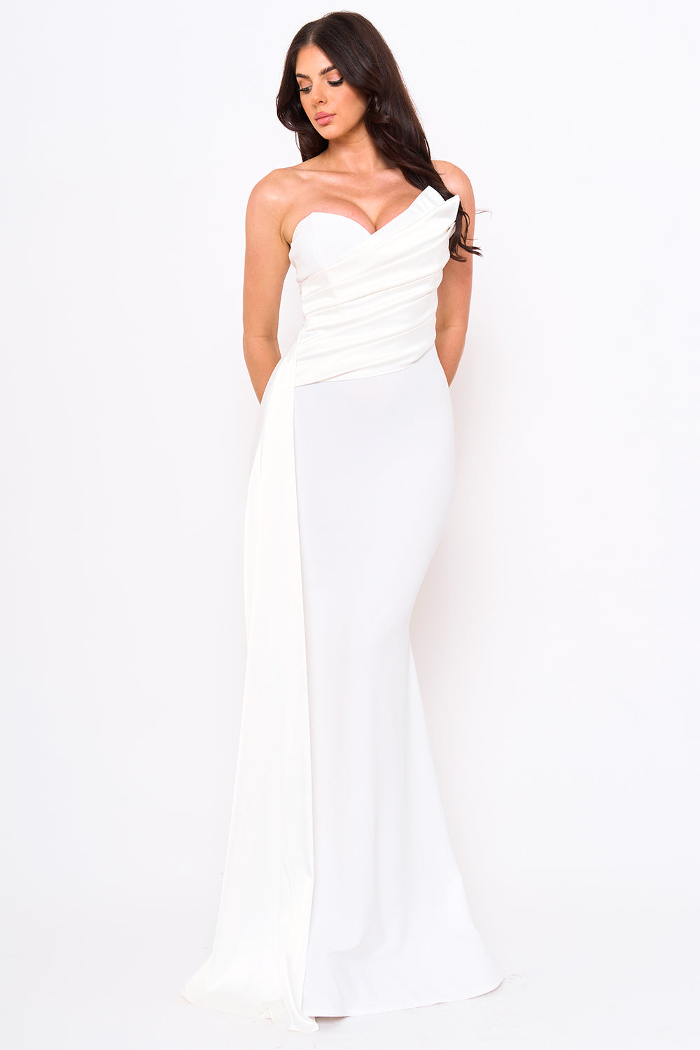 White strapless maxi evening dress with a draped bodice and elegant floor-length mermaid silhouette from Boutinie.