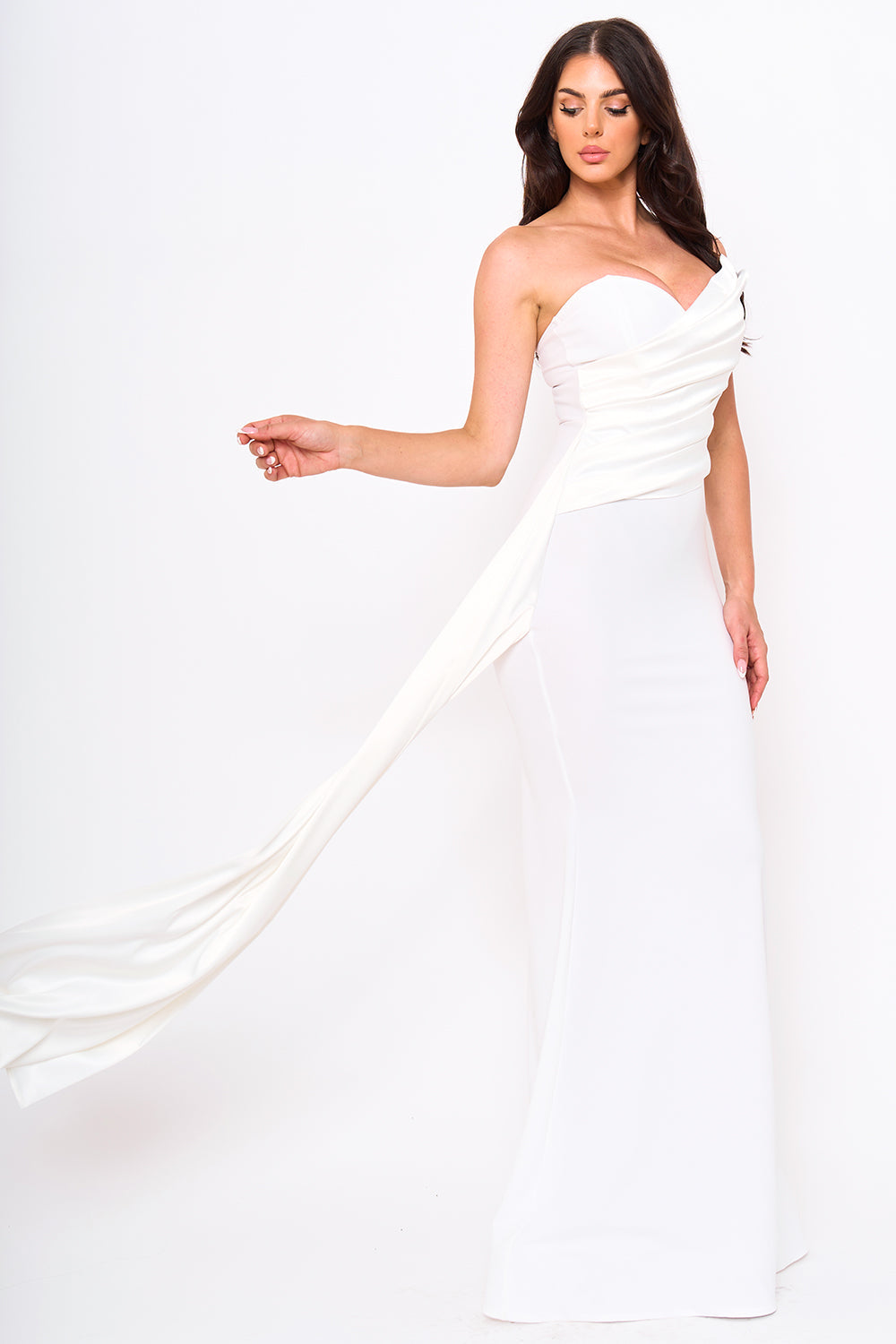 Boutinie white strapless maxi evening gown with a sweetheart neckline and dramatic draped side detail.
