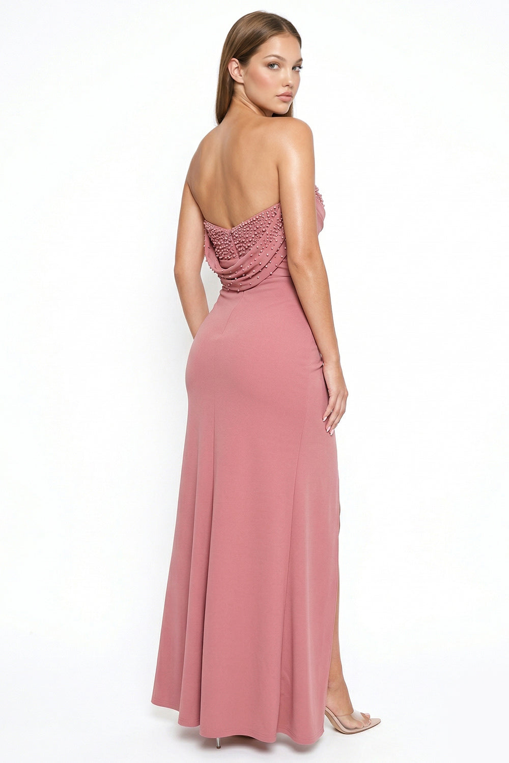 Dusty rose strapless formal gown with pearl-embellished back drape and high leg slit, by Boutinie.
