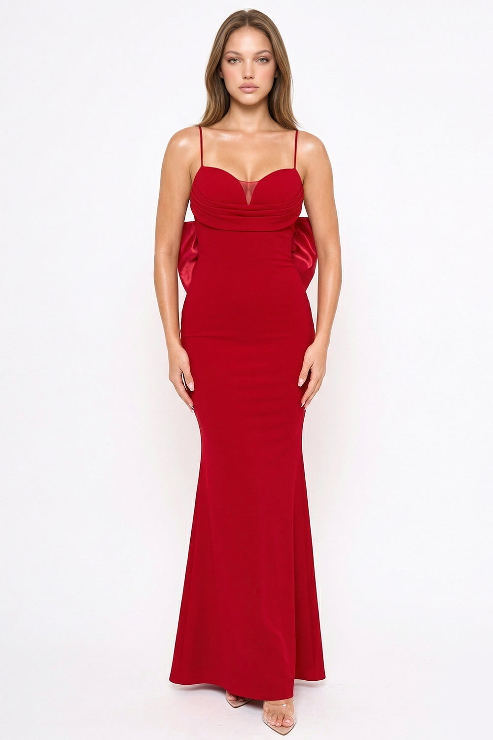 Red floor-length formal gown with spaghetti straps, sweetheart neckline, and back bow detail at Boutinie.