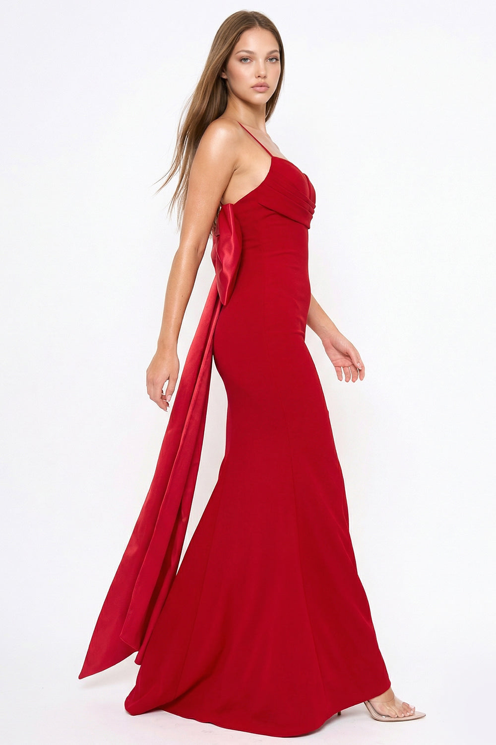 Red floor-length gown with spaghetti straps, sweetheart neckline, and dramatic satin bow back for formal events.