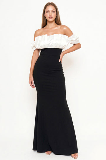 Elegant black and white off-the-shoulder formal gown with a pleated satin bodice and fitted floor-length skirt.