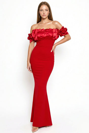 Red off-shoulder mermaid evening gown with a satin ruffled neckline and fitted silhouette from Boutinie.