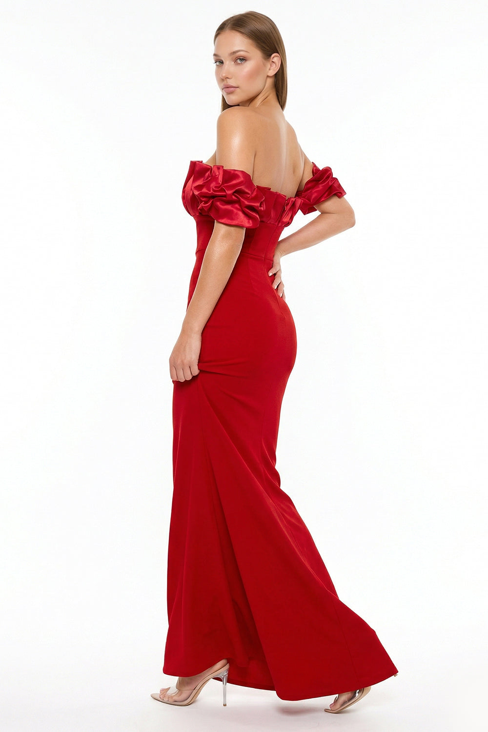 Red off-the-shoulder evening gown with ruffled sleeves, fitted silhouette, and floor-length skirt by Boutinie.