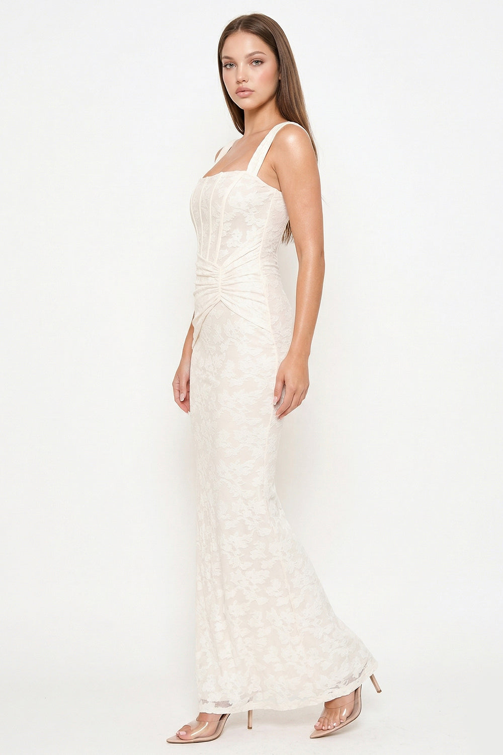 Cream lace maxi dress with corset-style bodice and thick straps for a sophisticated evening look from Boutinie.