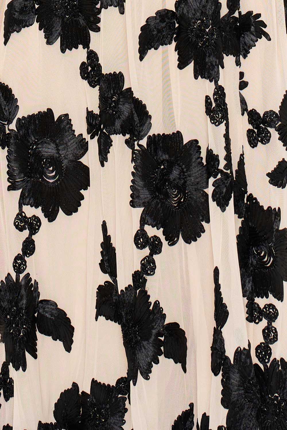 Cream tulle gown with intricate black floral embroidery, perfect for a sophisticated formal evening occasion.