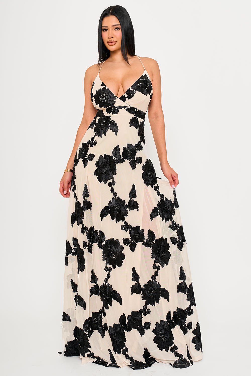 Boutinie beige maxi dress with black floral embroidery, V-neck, and spaghetti straps for formal evening wear.