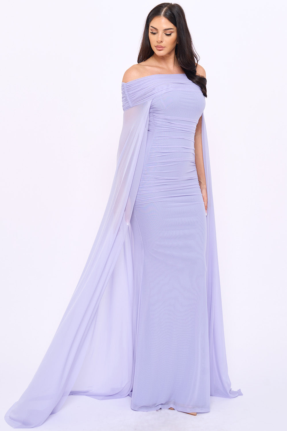 Lavender off-the-shoulder ruched evening gown with flowing cape sleeves by Boutinie.