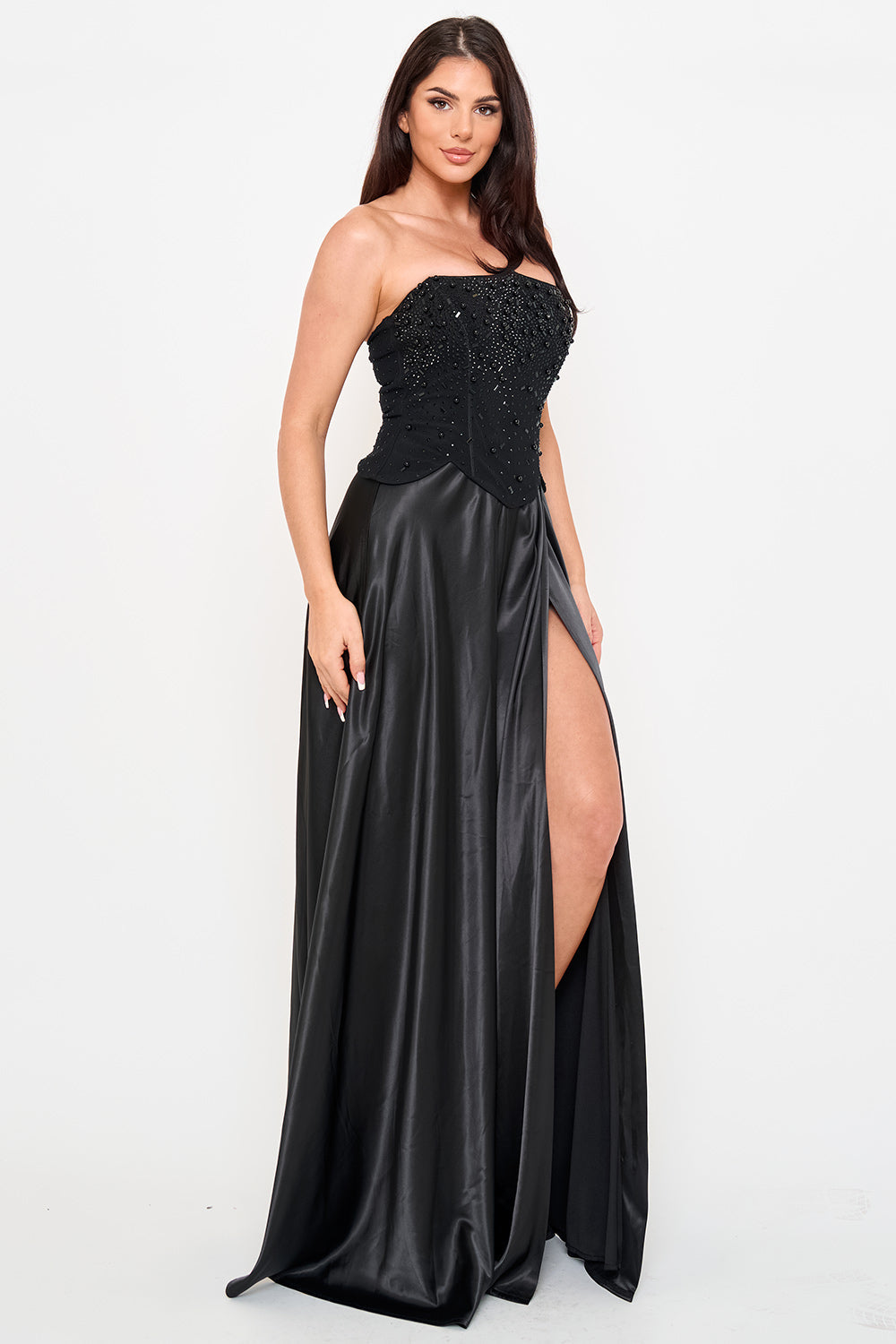 Black strapless gown with a beaded bodice and satin skirt featuring a high leg slit, perfect for formal events.