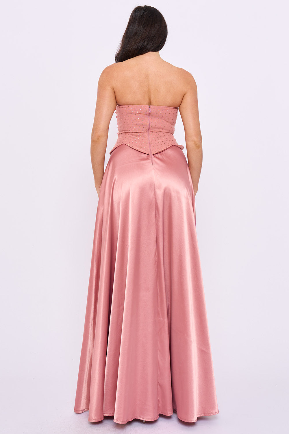 Back view of a strapless dusty rose satin corset gown with beaded bodice for formal events by Boutinie.