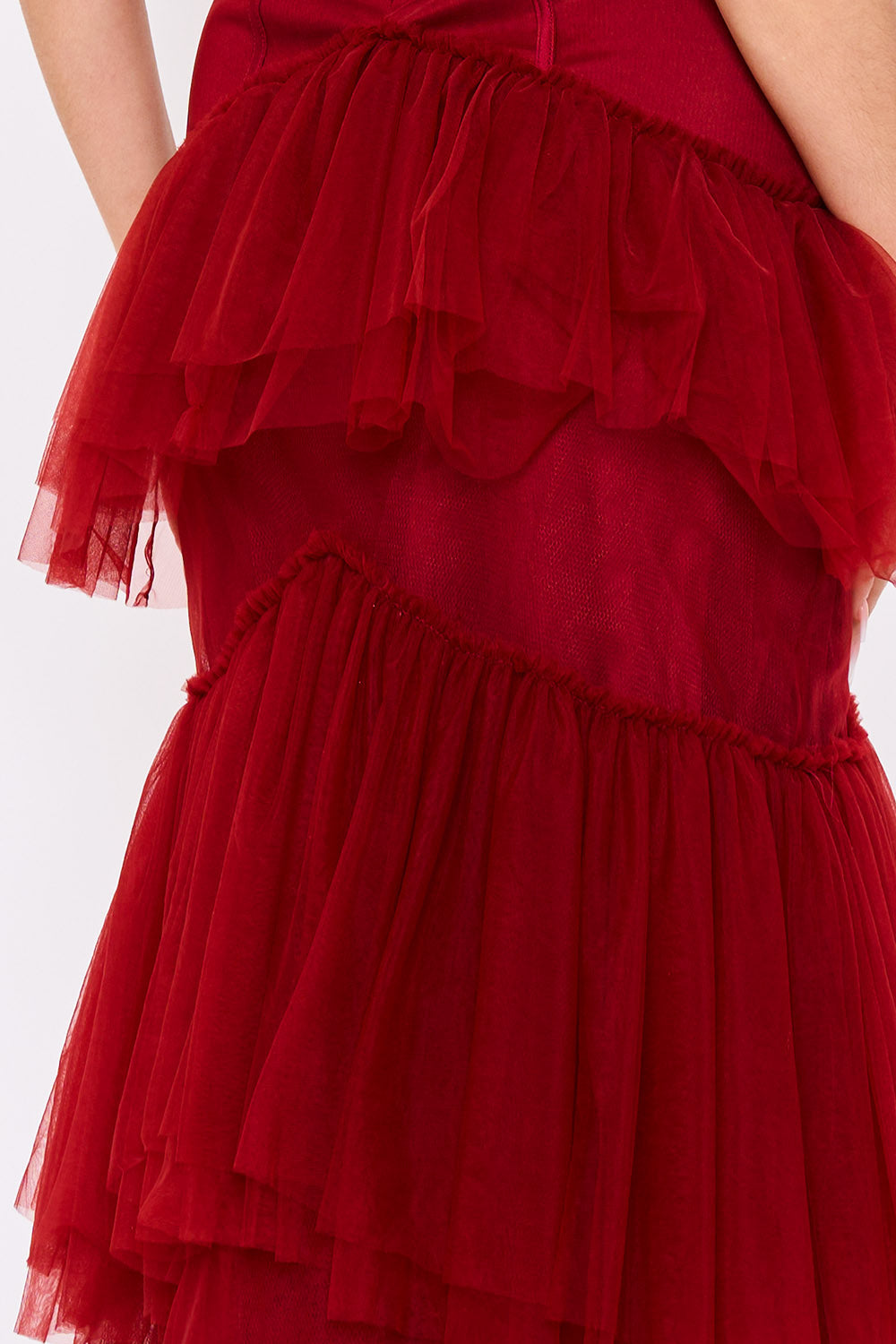 Deep red tiered tulle cocktail dress with a sleeveless, fitted bodice from Boutinie.